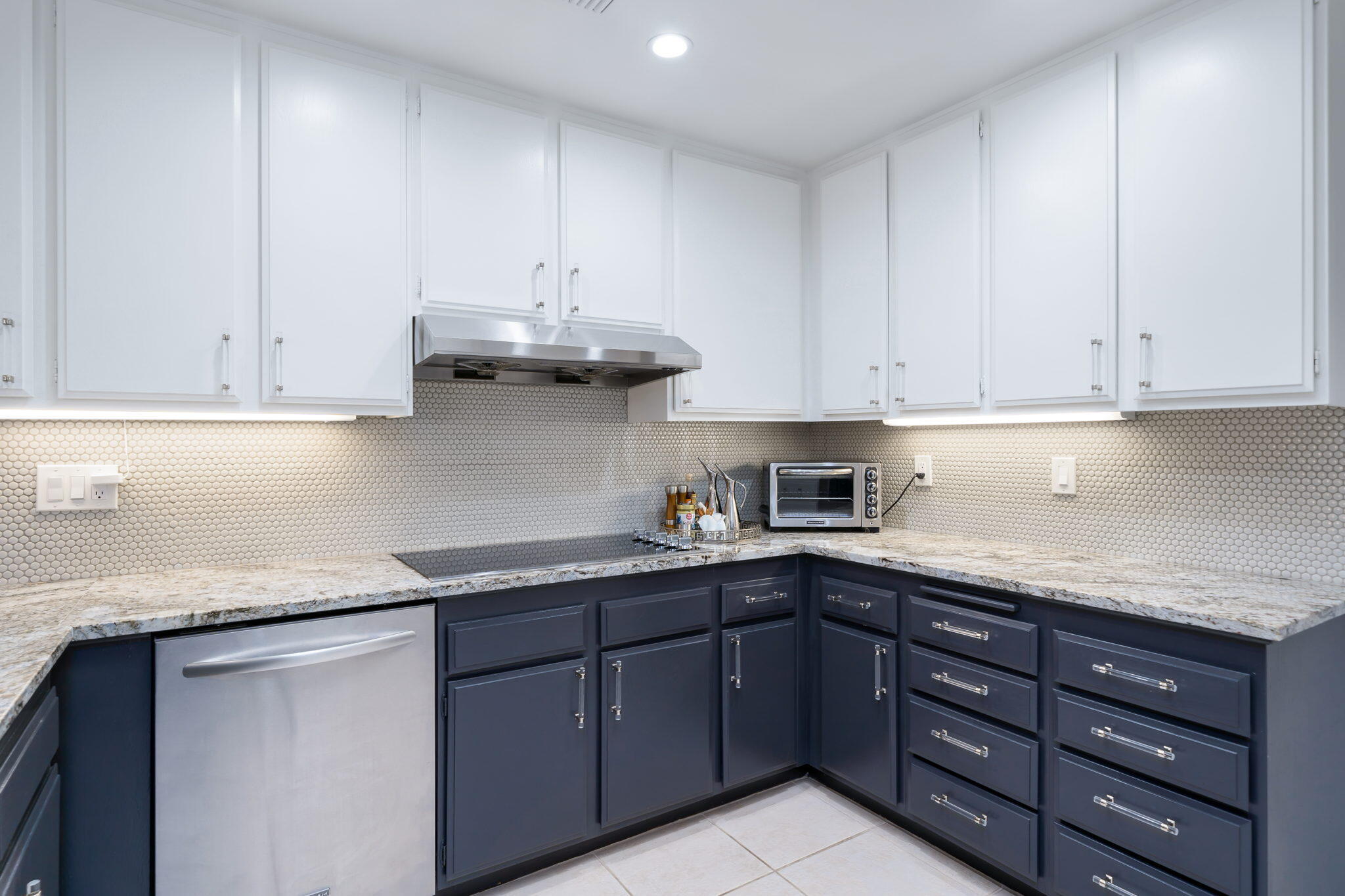 18 Lehigh Court Rancho Mirage, CA 92270 - Photo 21 of 53 a kitchen with stainless steel appliances granite countertop a sink and dishwasher with cabinets