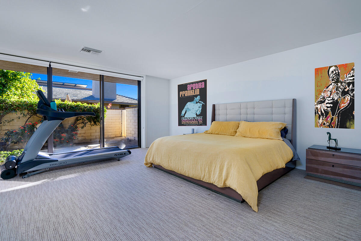 18 Lehigh Court Rancho Mirage, CA 92270 - Photo 25 of 53 a bedroom with a bed and a table