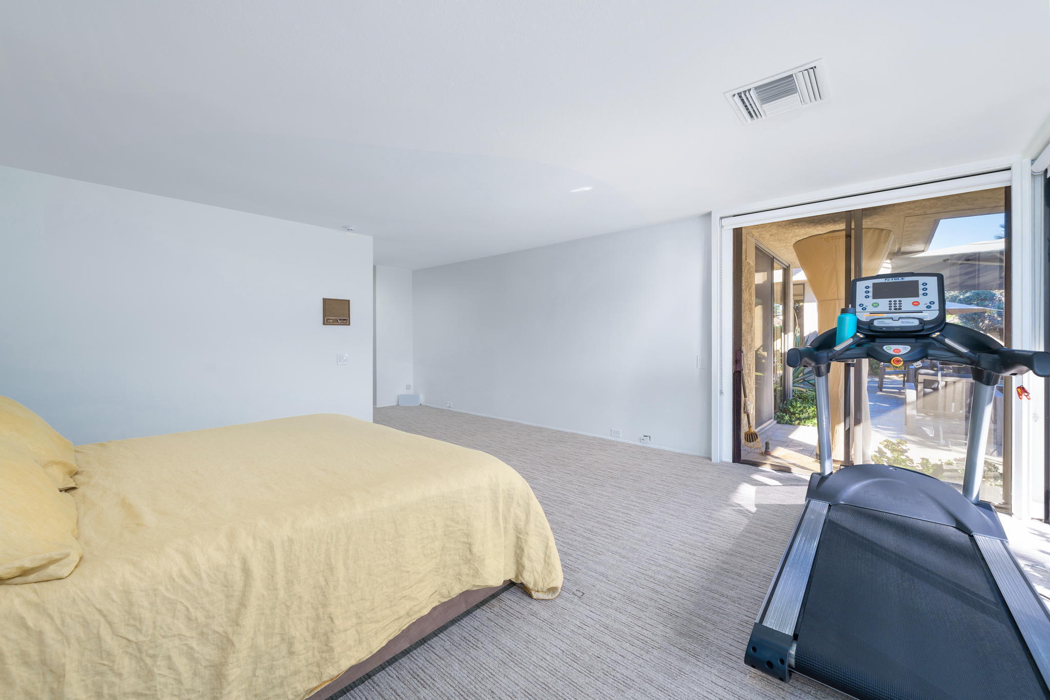 18 Lehigh Court Rancho Mirage, CA 92270 - Photo 26 of 53 a bedroom with a bed and large window