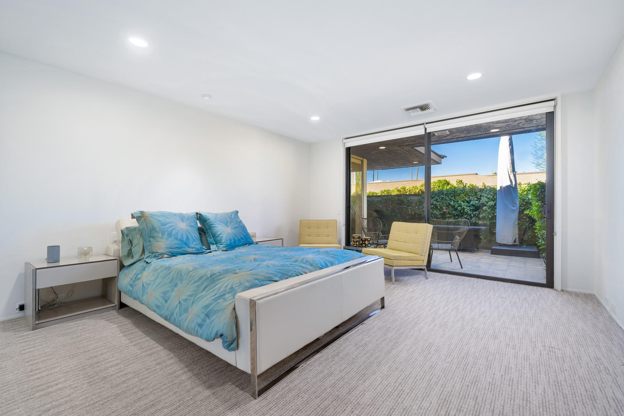 18 Lehigh Court Rancho Mirage, CA 92270 - Photo 31 of 53 a spacious bedroom with a bed and large window