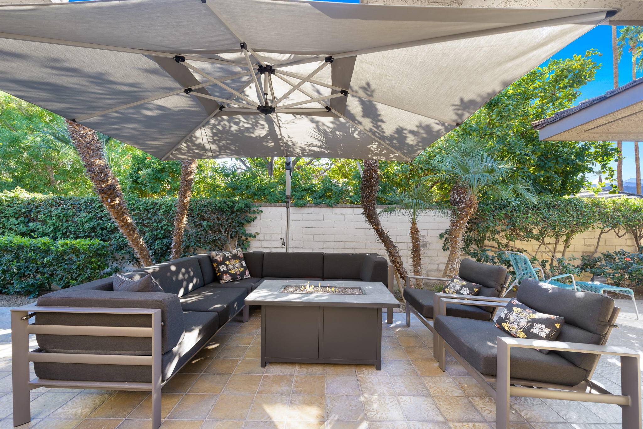 18 Lehigh Court Rancho Mirage, CA 92270 - Photo 39 of 53 a view of a patio with a table and chairs