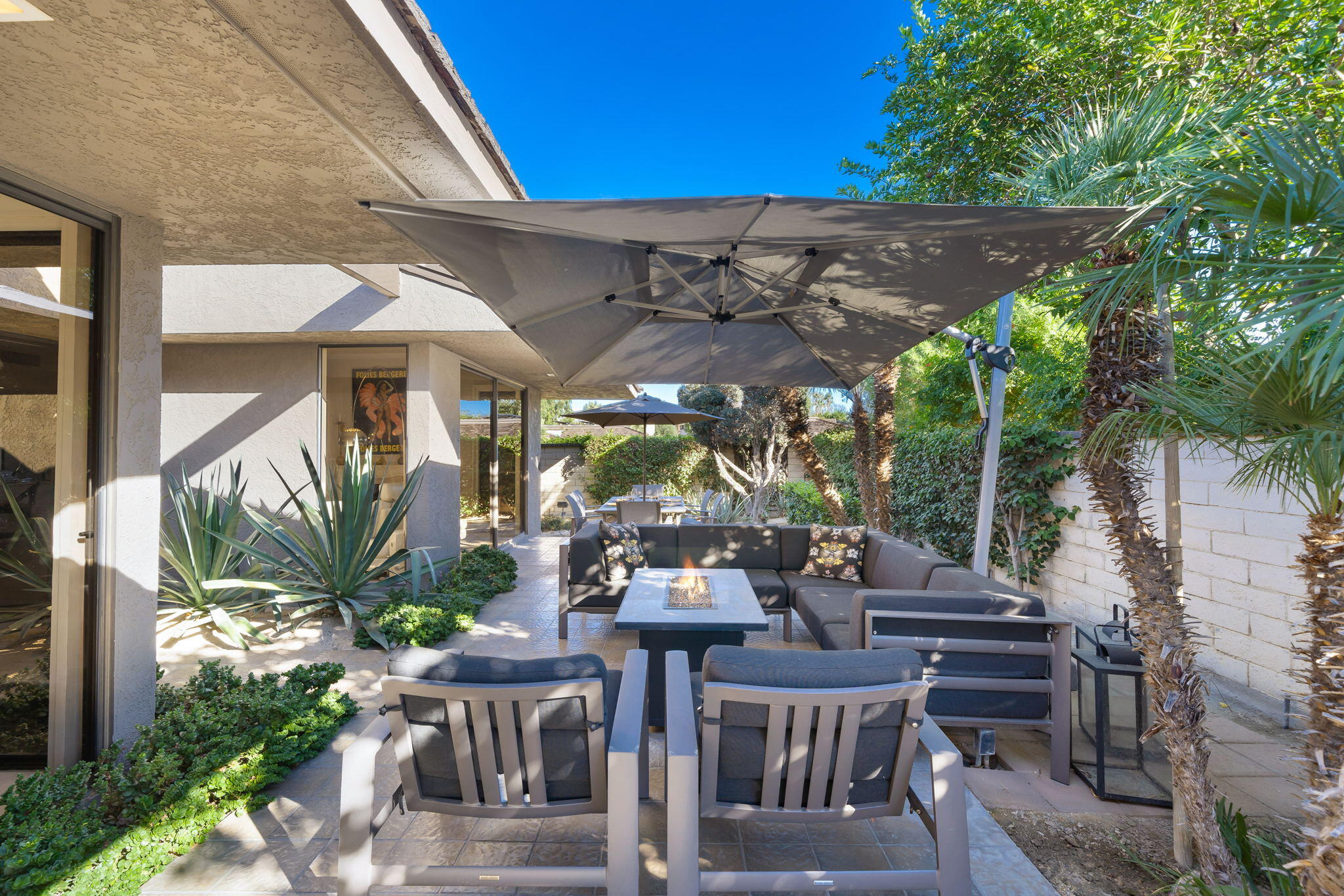 18 Lehigh Court Rancho Mirage, CA 92270 - Photo 48 of 53 a view of a patio with table and chairs potted plants