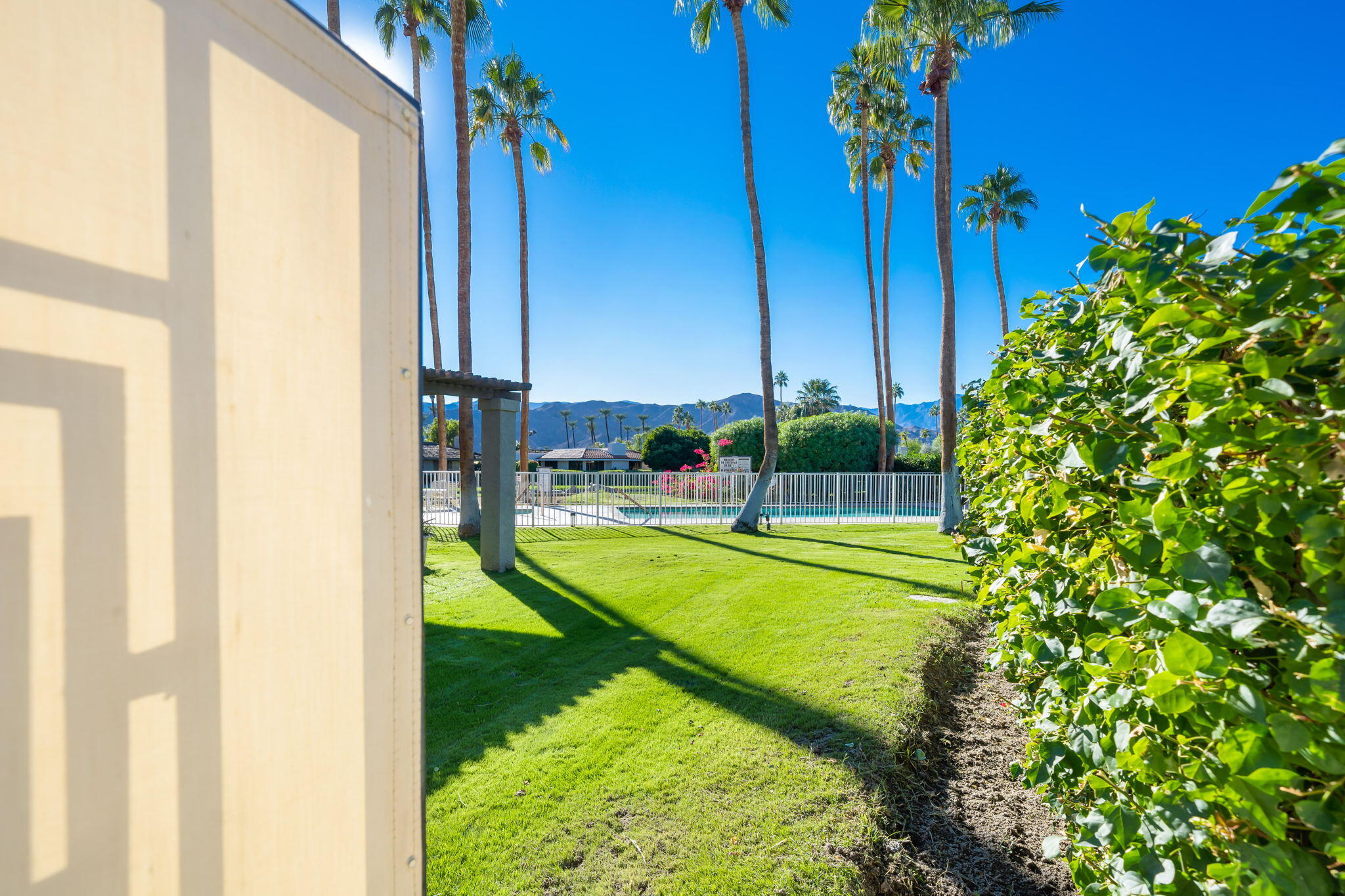 18 Lehigh Court Rancho Mirage, CA 92270 - Photo 49 of 53 a view of a swimming pool with a garden