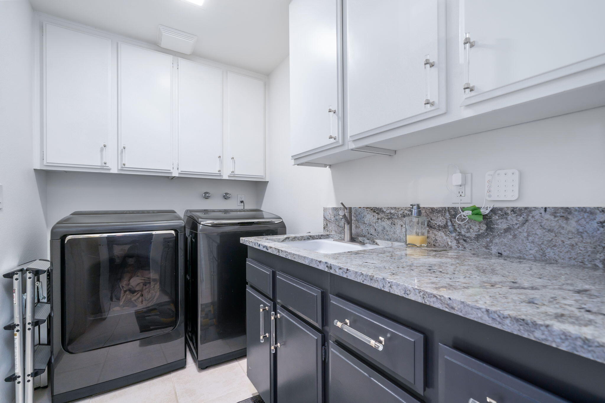18 Lehigh Court Rancho Mirage, CA 92270 - Photo 53 of 53 a kitchen with granite countertop white cabinets and white appliances