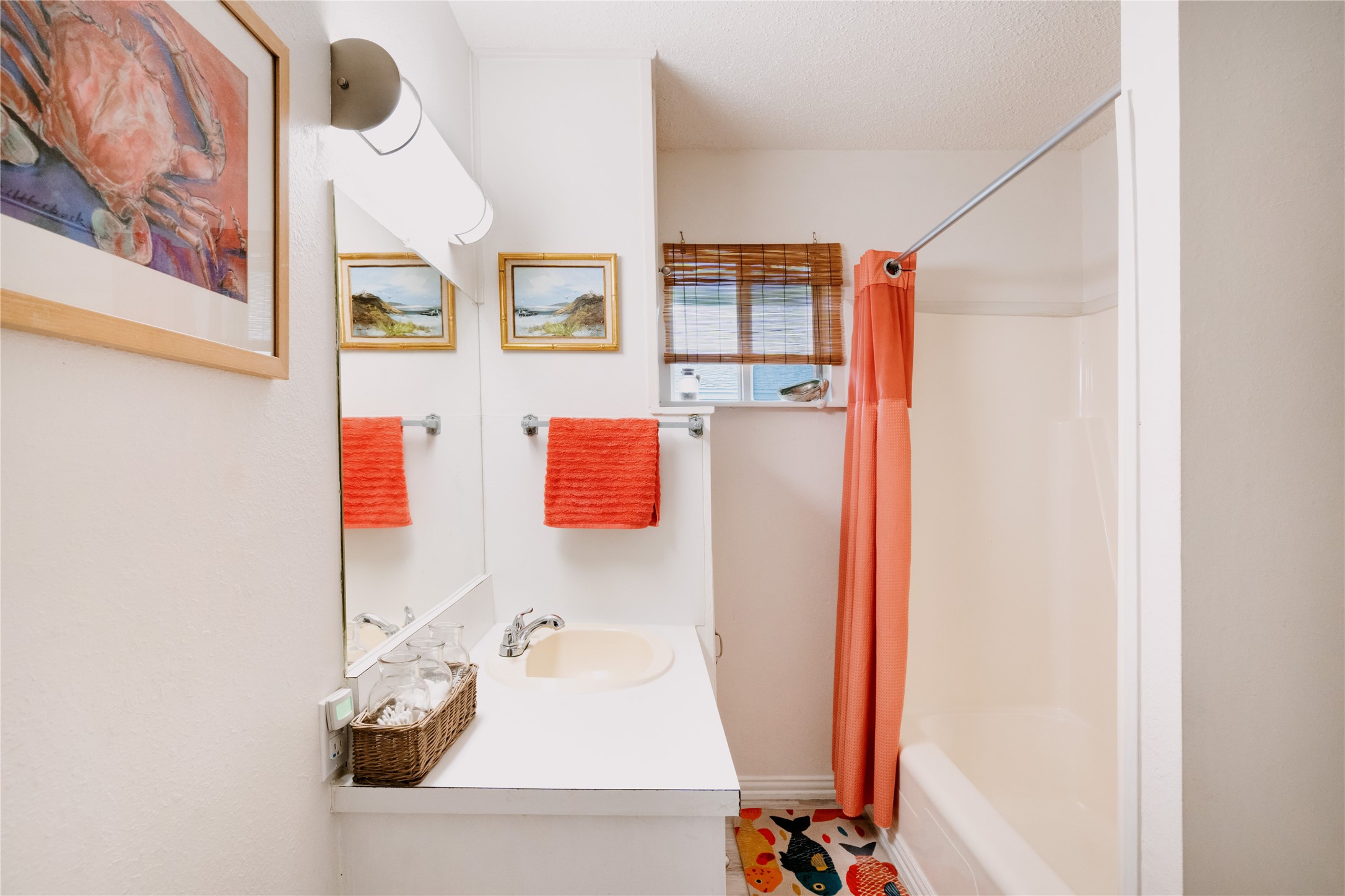 88 Bay Street Port O'Connor, TX 77982 - Photo 14 of 23 a bathroom with a sink and a mirror