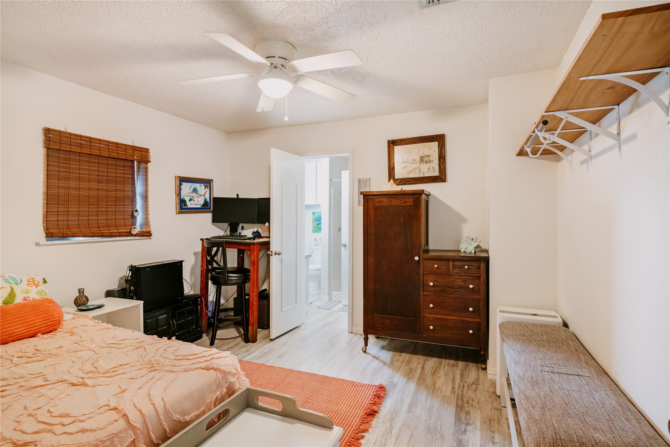 88 Bay Street Port O'Connor, TX 77982 - Photo 16 of 23 a bedroom with a bed and wooden floor