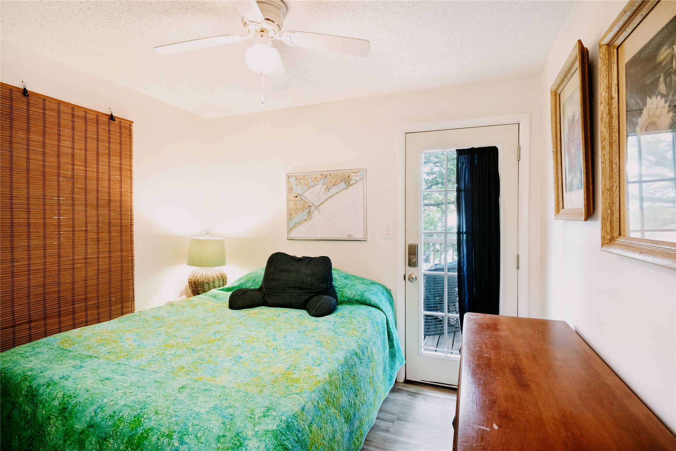 88 Bay Street Port O'Connor, TX 77982 - Photo 17 of 23 a bedroom with a bed and a large window