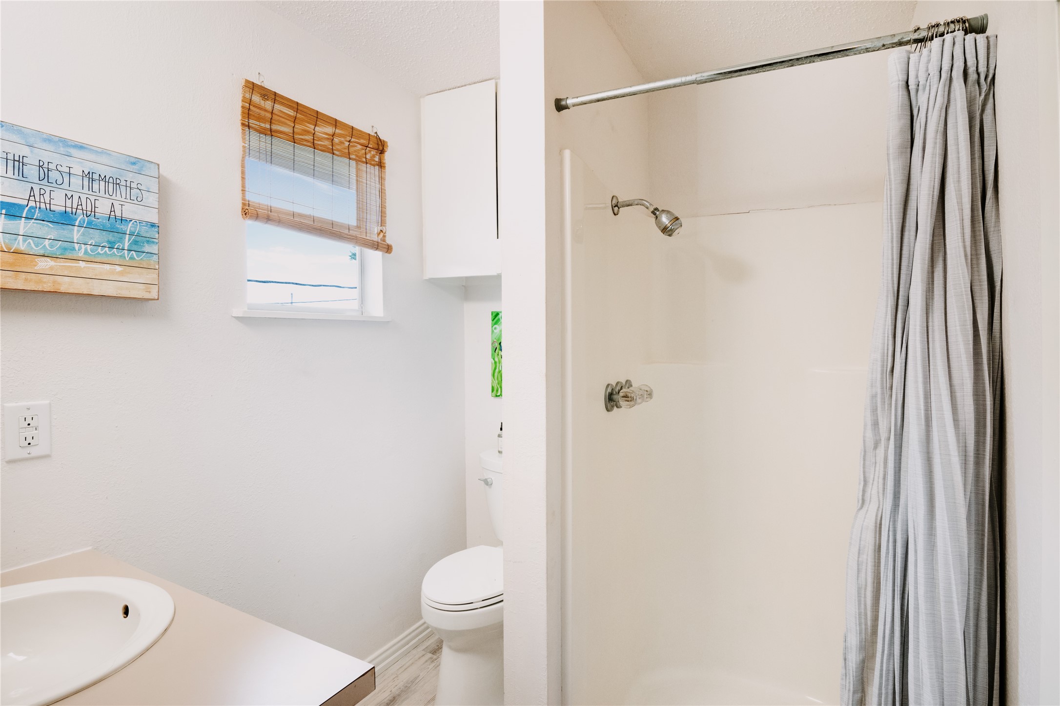 88 Bay Street Port O'Connor, TX 77982 - Photo 18 of 23 a bathroom with a shower and a toilet