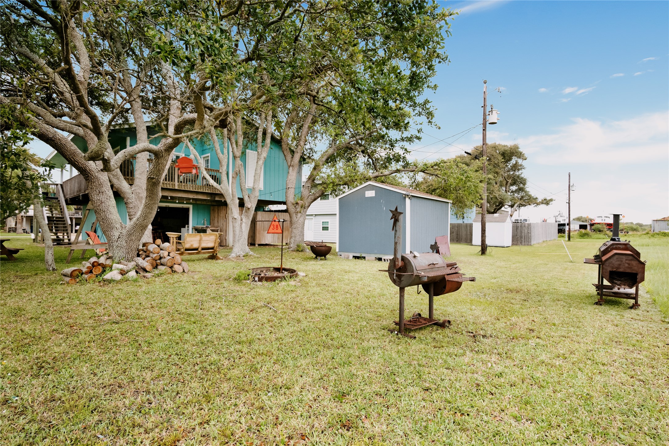 88 Bay Street Port O'Connor, TX 77982 - Photo 21 of 23 a view of swimming pool with a yard and seating area