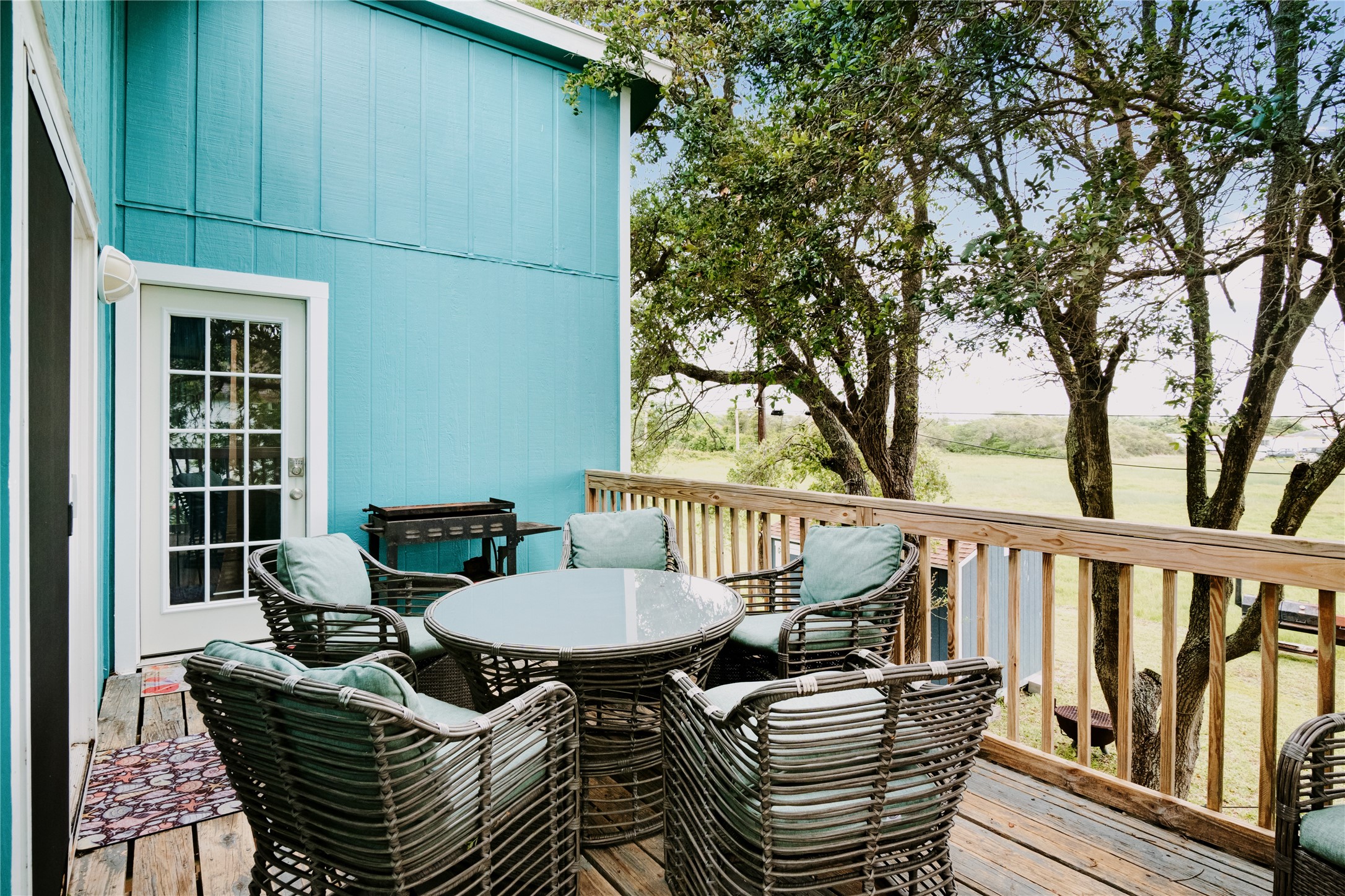 88 Bay Street Port O'Connor, TX 77982 - Photo 3 of 23 a view of a chairs and table in the balcony