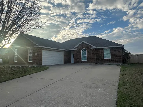 a front view of a house with garage