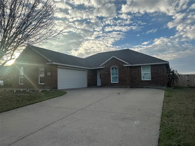 a front view of a house with garage