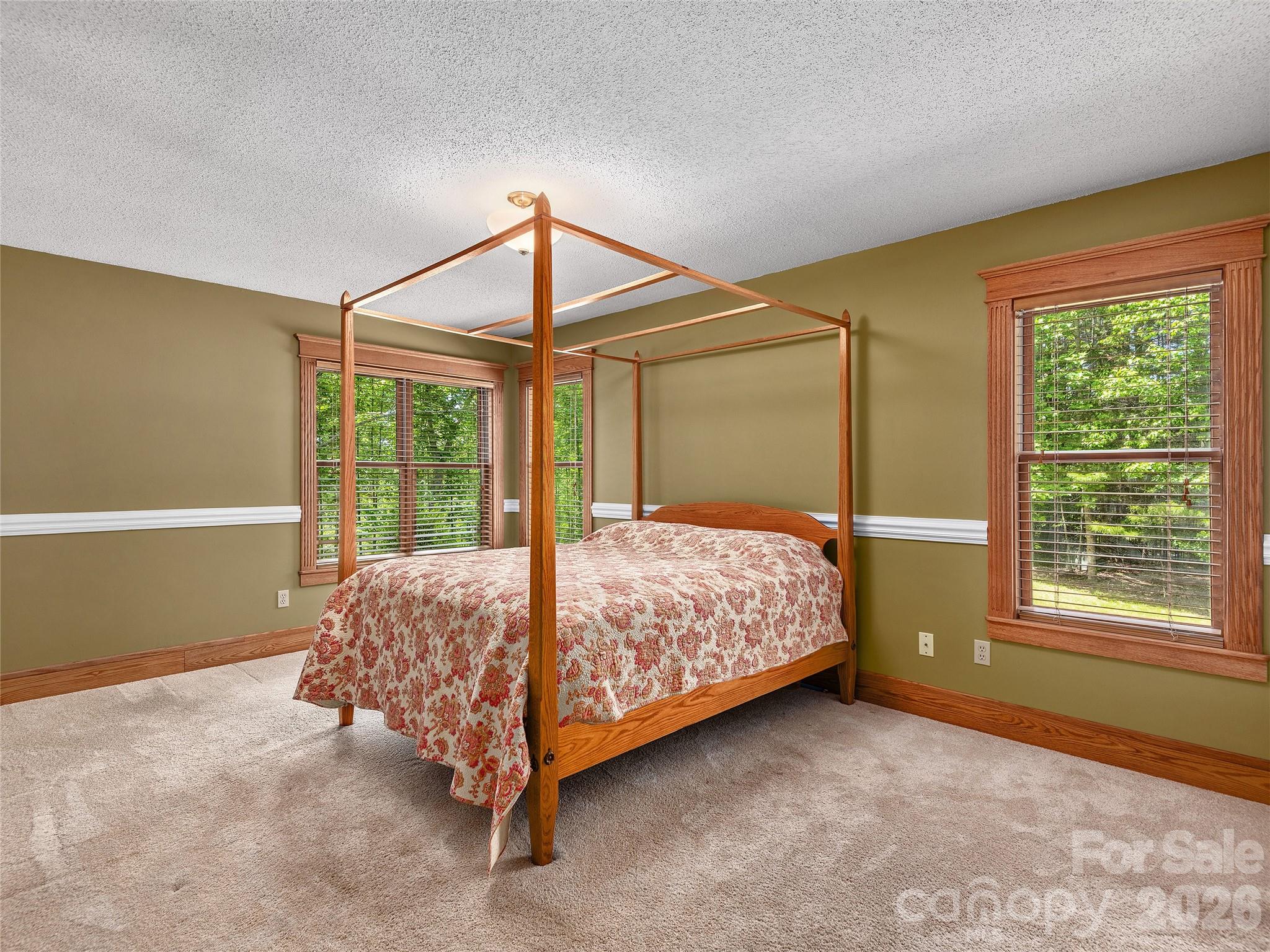 40 Deer Ridge Road Mills River, NC 28759 - Photo 24 of 35 a bed sitting in a bedroom next to a window