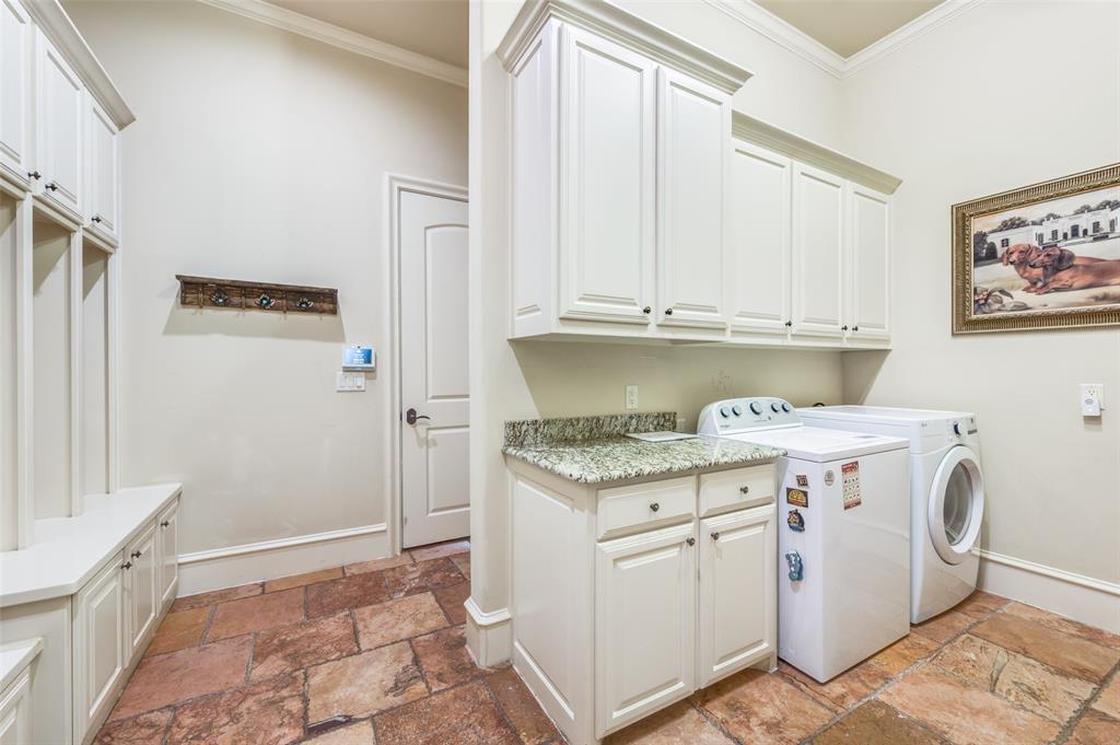 141 Waters Edge Way Oak Point, TX 75068 - Photo 20 of 25 a view of cabinets with washer and dryer