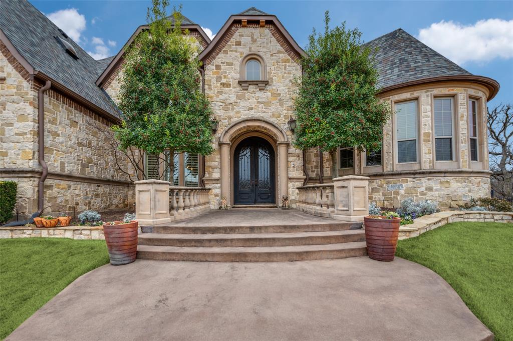 141 Waters Edge Way Oak Point, TX 75068 - Photo 2 of 25 a front view of a house with garden