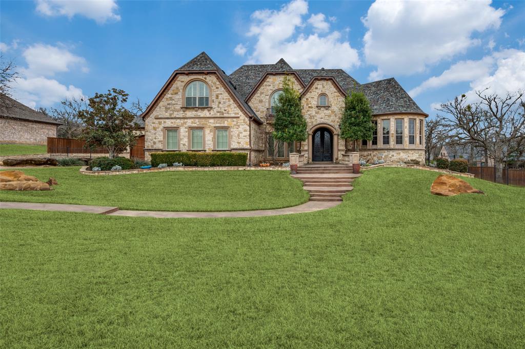 141 Waters Edge Way Oak Point, TX 75068 - Photo 3 of 25 a front view of house with yard and green space