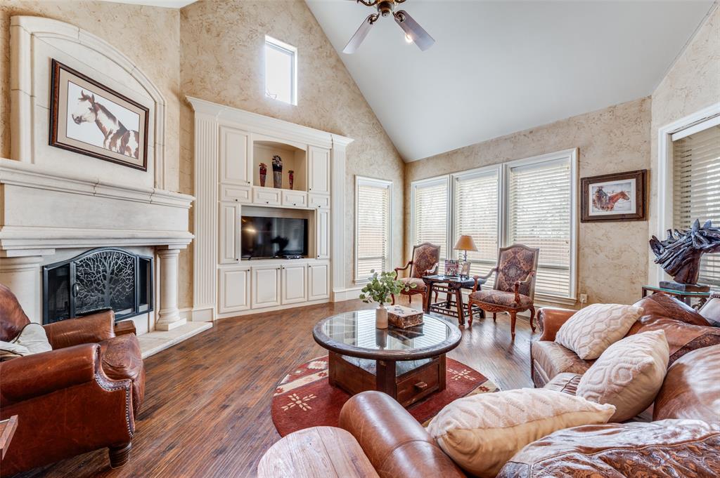 141 Waters Edge Way Oak Point, TX 75068 - Photo 8 of 25 a living room with furniture fireplace and window