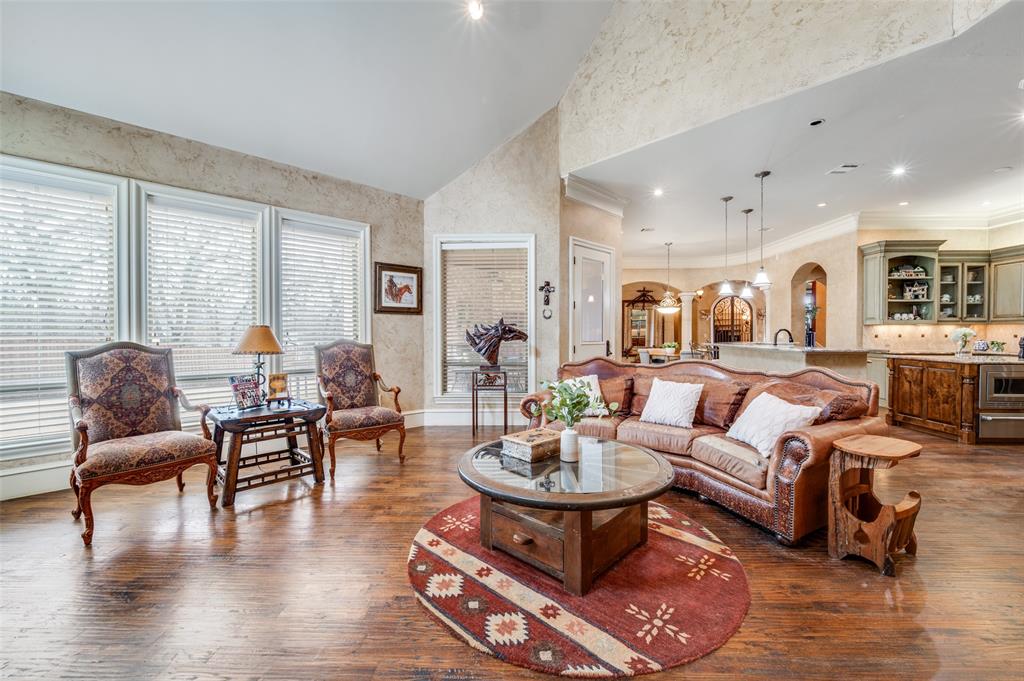141 Waters Edge Way Oak Point, TX 75068 - Photo 9 of 25 a living room with furniture or couch and a large window