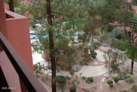 a view of a yard from a balcony