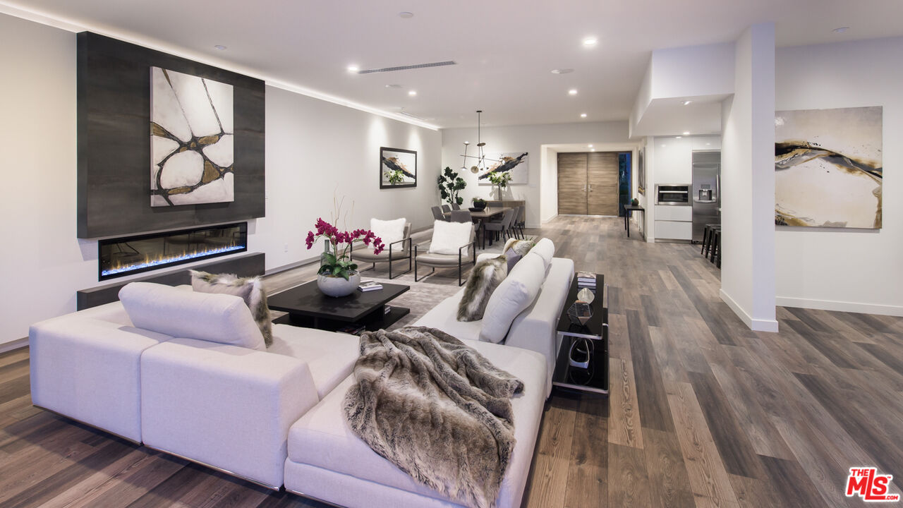 2213 Roscomare Road Los Angeles, CA 90077 - Photo 13 of 39 a living room with furniture and wooden floor