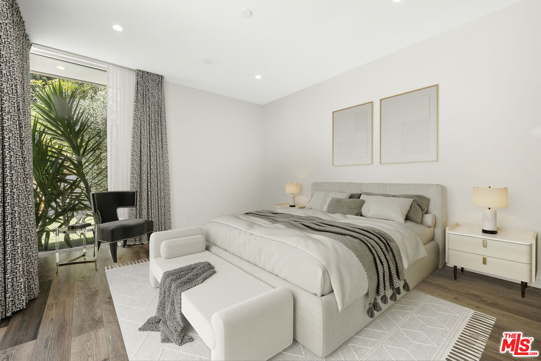 2213 Roscomare Road Los Angeles, CA 90077 - Photo 28 of 39 a bedroom with a bed and a couch