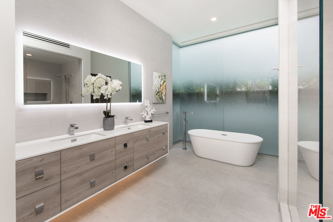 2213 Roscomare Road Los Angeles, CA 90077 - Photo 30 of 39 a bathroom with a double vanity sink mirror and toilet