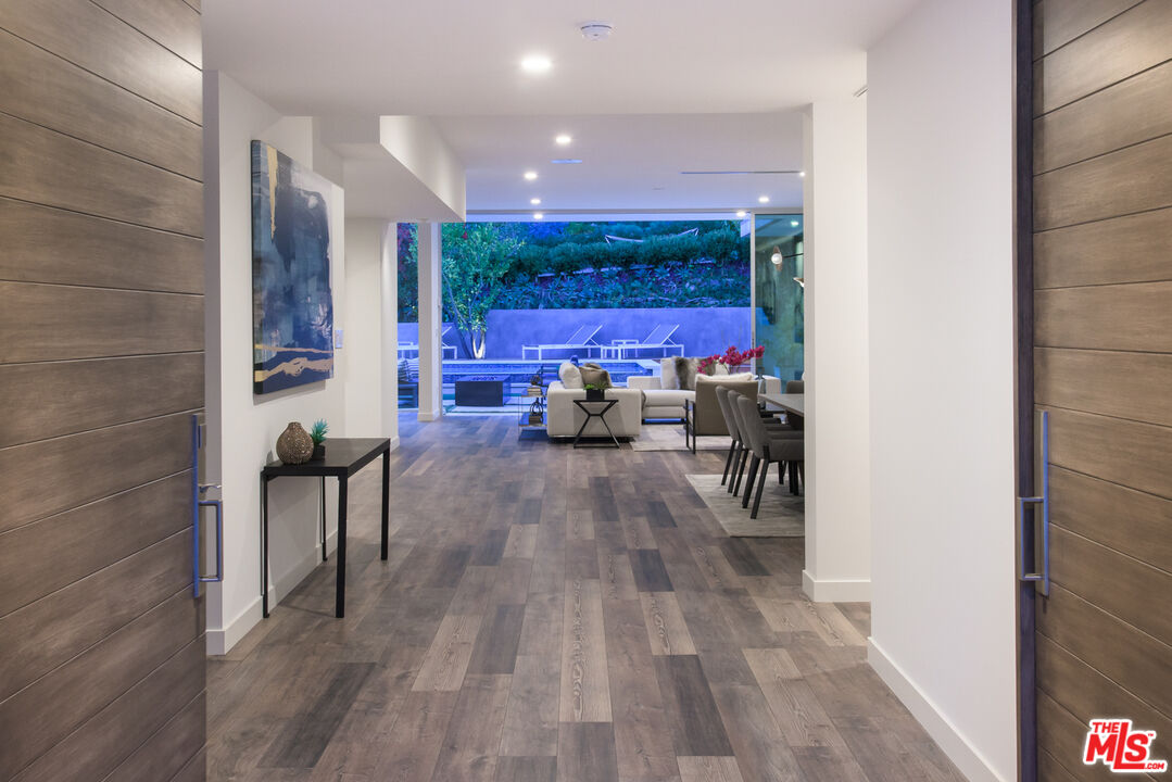 2213 Roscomare Road Los Angeles, CA 90077 - Photo 3 of 39 a view of a entryway with furniture and wooden floor