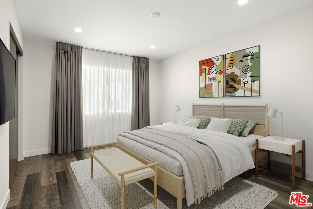2213 Roscomare Road Los Angeles, CA 90077 - Photo 39 of 39 a bedroom with a bed and a painting on the wall