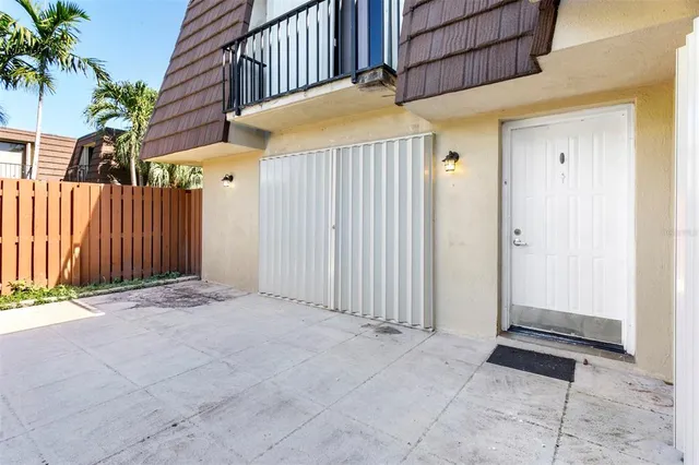 a view of backyard with potted plants