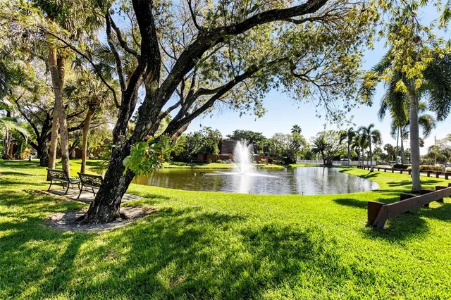 a view of swimming pool with outdoor seating and yard