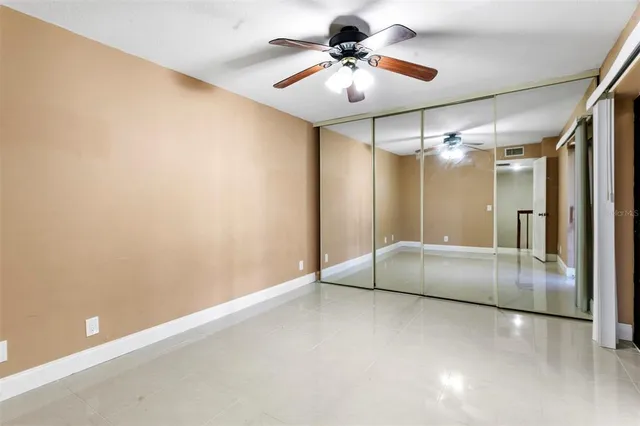 a view of livingroom with hardwood floor and a ceiling fan
