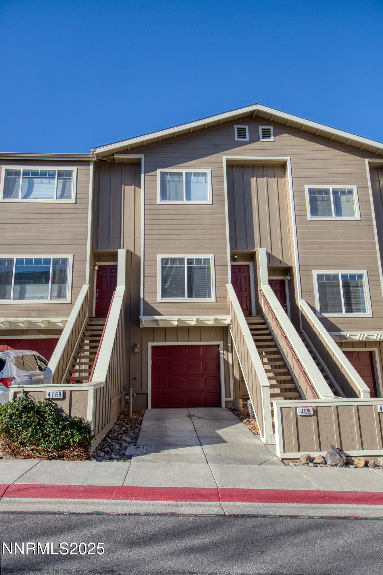 a front view of a house with a garage