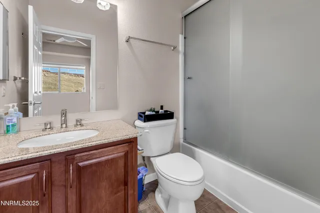a view of a balcony with chair and wooden floor