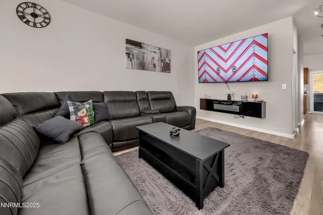 a living room with furniture and a rug