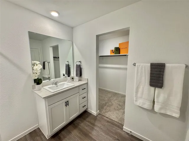 a bathroom with a sink and mirror