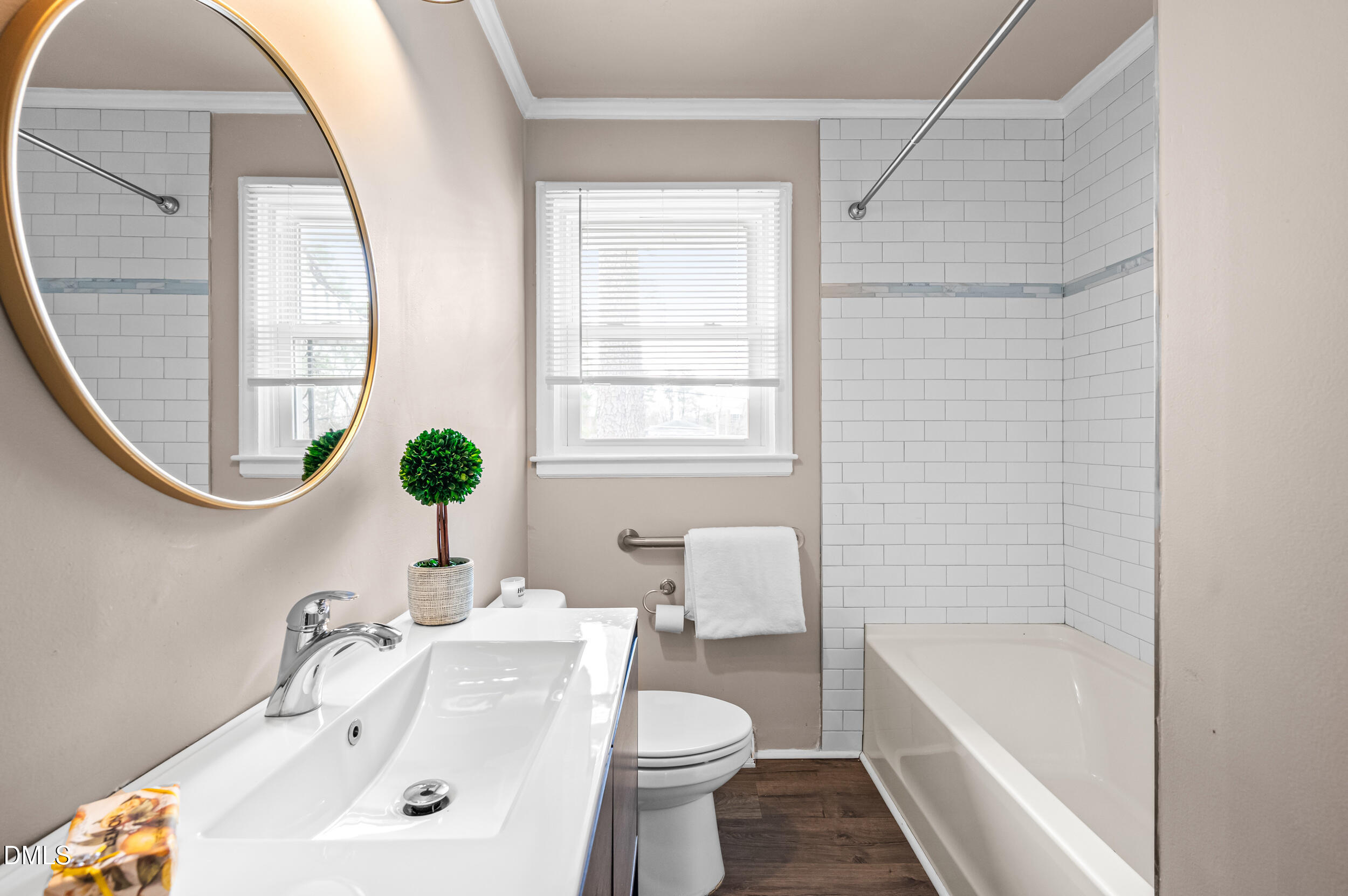 401 Moline Street Durham, NC 27707 - Photo 13 of 20 a bathroom with a sink a toilet and a bathtub