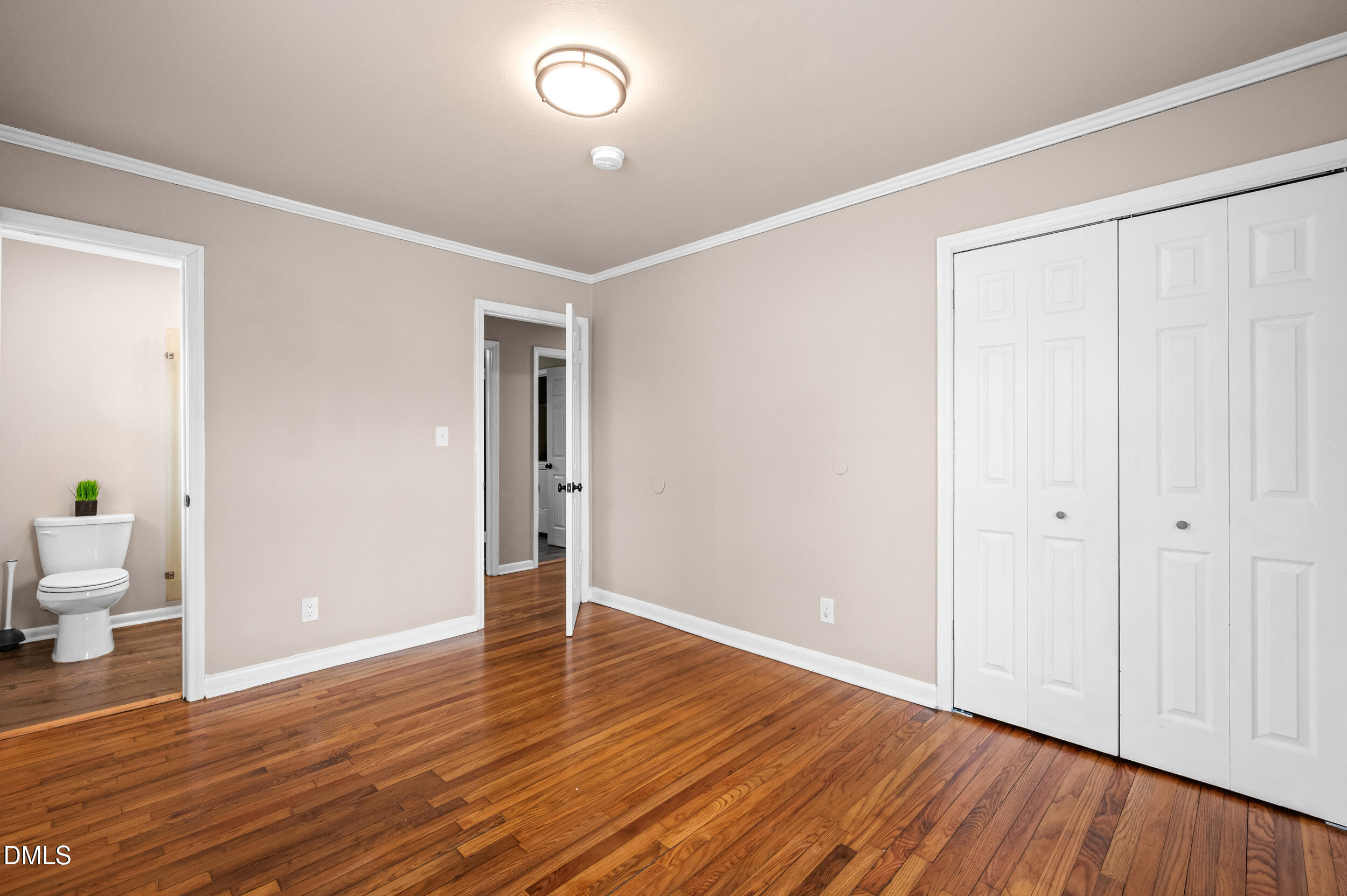 401 Moline Street Durham, NC 27707 - Photo 15 of 20 a view of an empty room with wooden floor