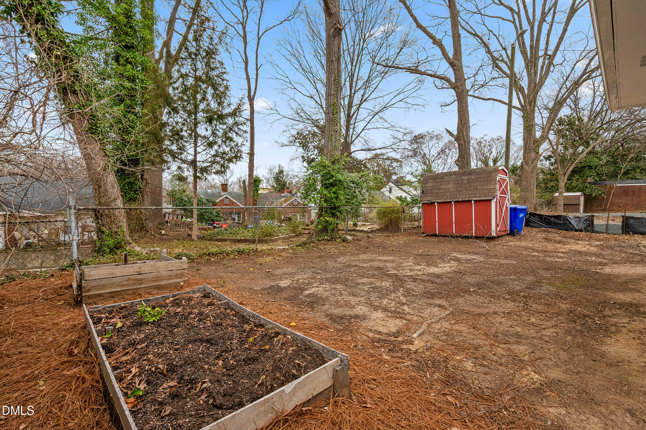 401 Moline Street Durham, NC 27707 - Photo 19 of 20 a view of a backyard with wooden fence