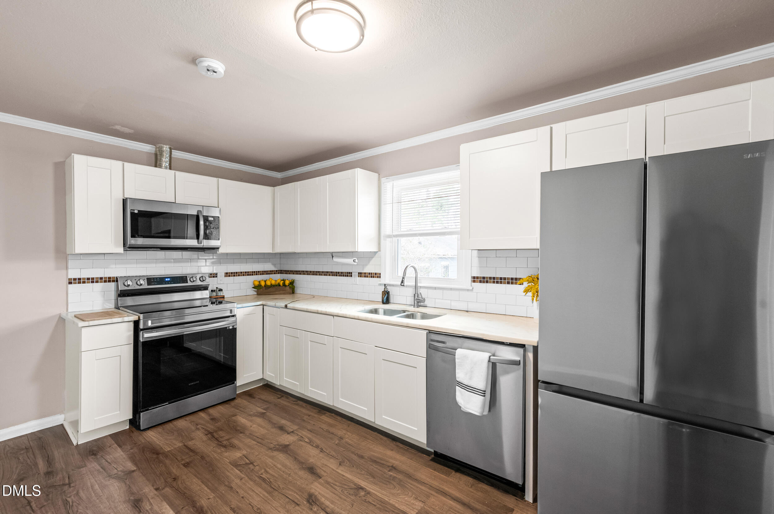 401 Moline Street Durham, NC 27707 - Photo 6 of 20 a kitchen with a refrigerator sink and microwave