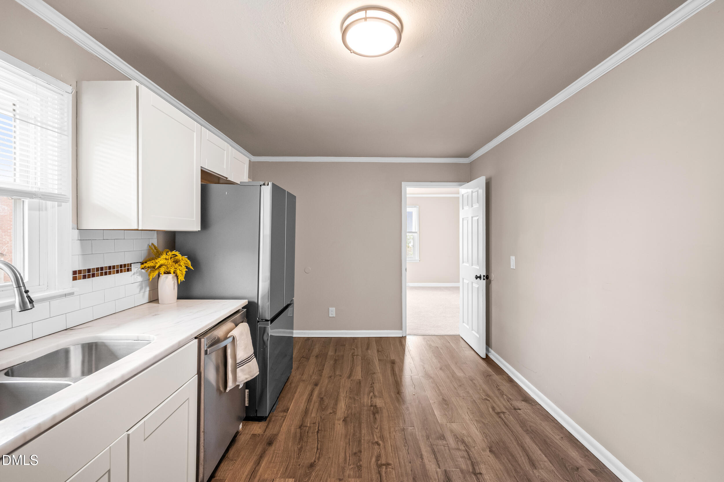 401 Moline Street Durham, NC 27707 - Photo 8 of 20 a view of a kitchen with wooden floor and electronic appliances