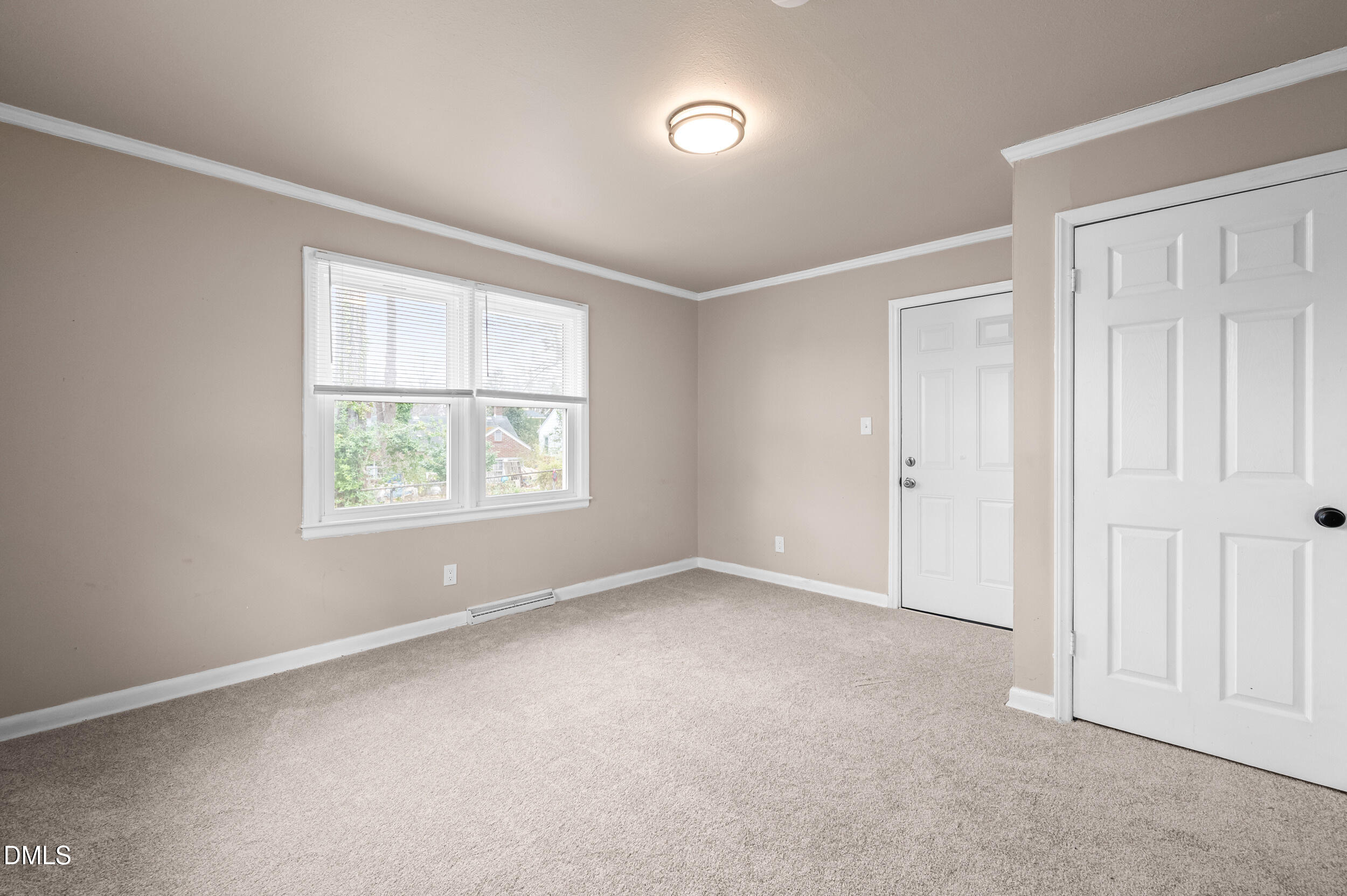 401 Moline Street Durham, NC 27707 - Photo 9 of 20 an empty room with windows
