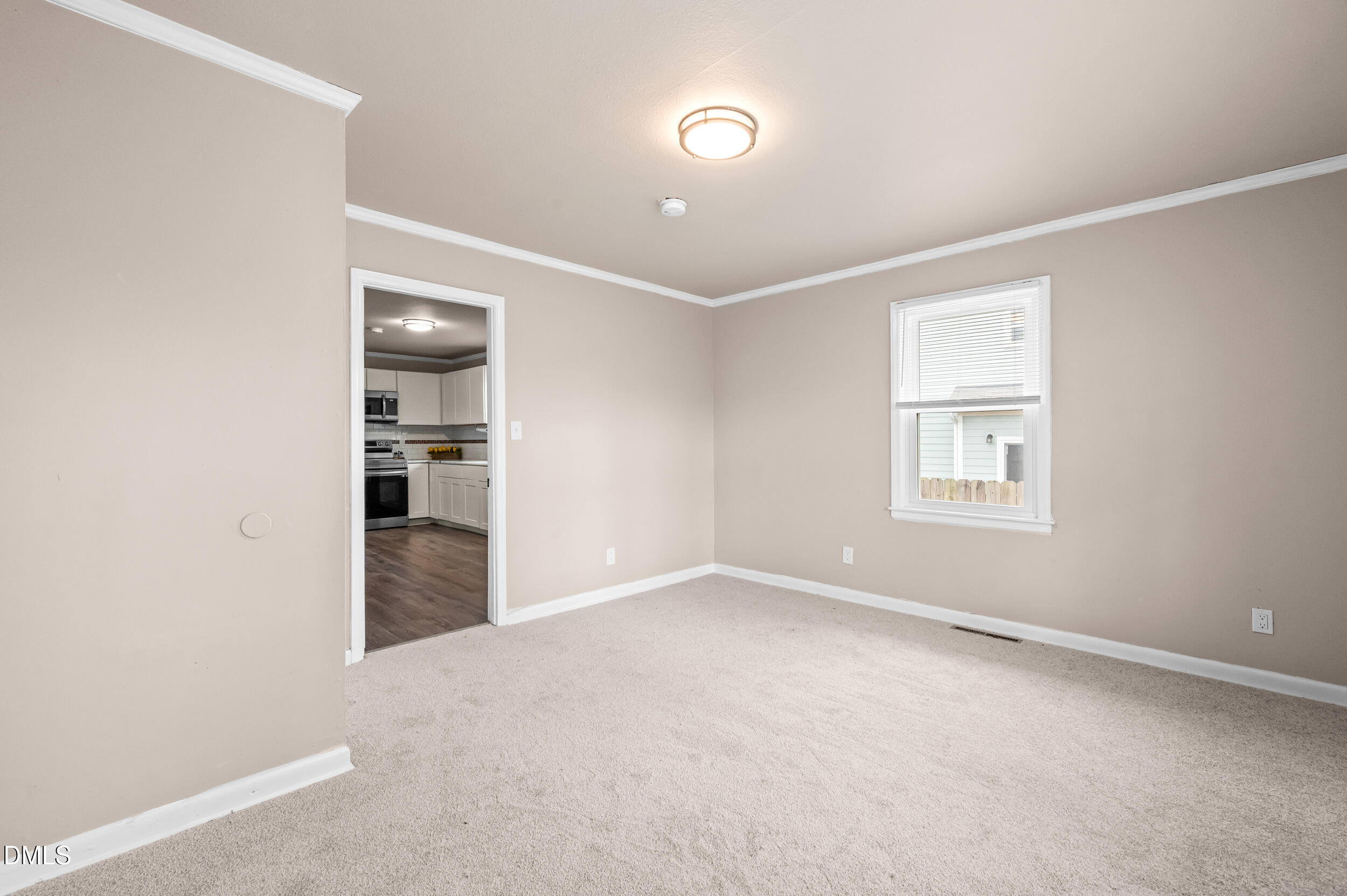401 Moline Street Durham, NC 27707 - Photo 10 of 20 an empty room with closet and windows