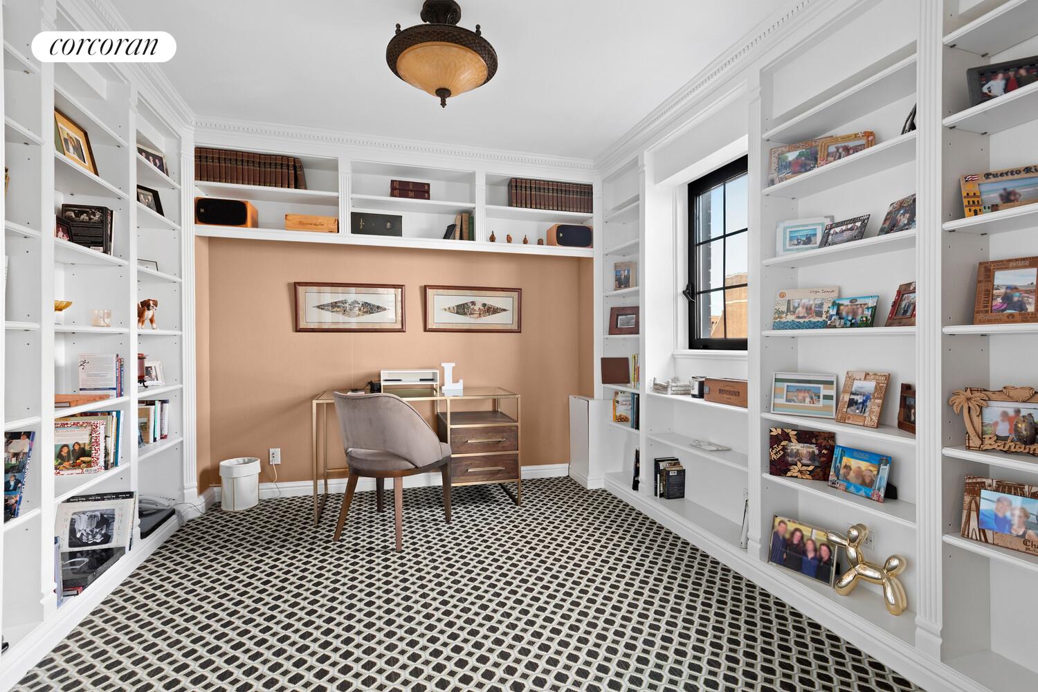 440 East 57th Street, Unit PH Manhattan, NY 10022 - Photo 8 of 18 a living room with a bookshelf and a window