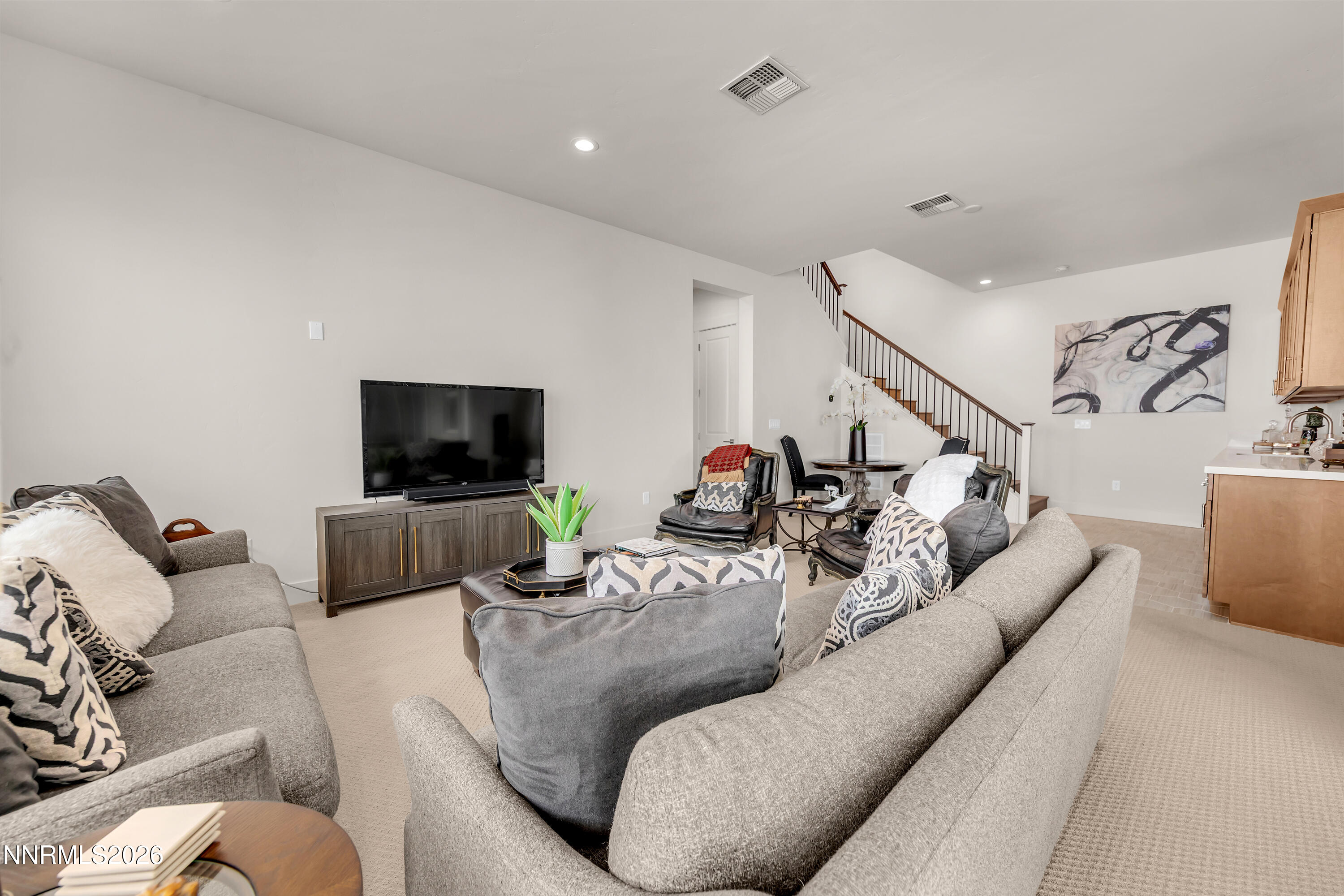 9109 Wild Skies Way Reno, NV 89523 - Photo 19 of 81 a living room with furniture and a flat screen tv