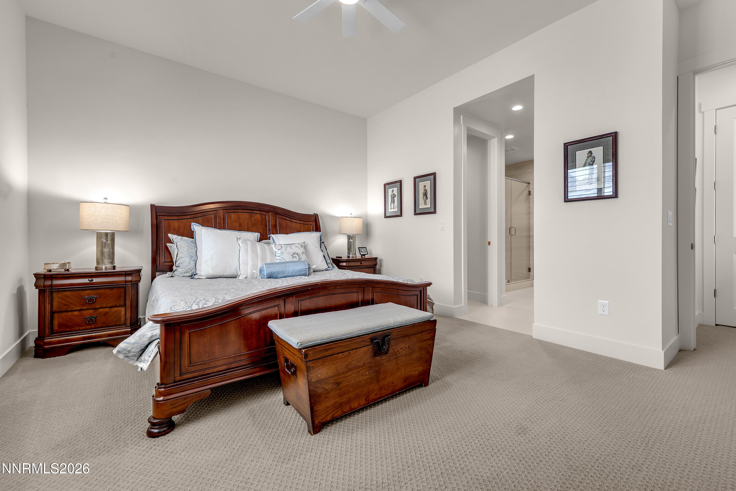 9109 Wild Skies Way Reno, NV 89523 - Photo 27 of 81 a bedroom with a bed and a lamp