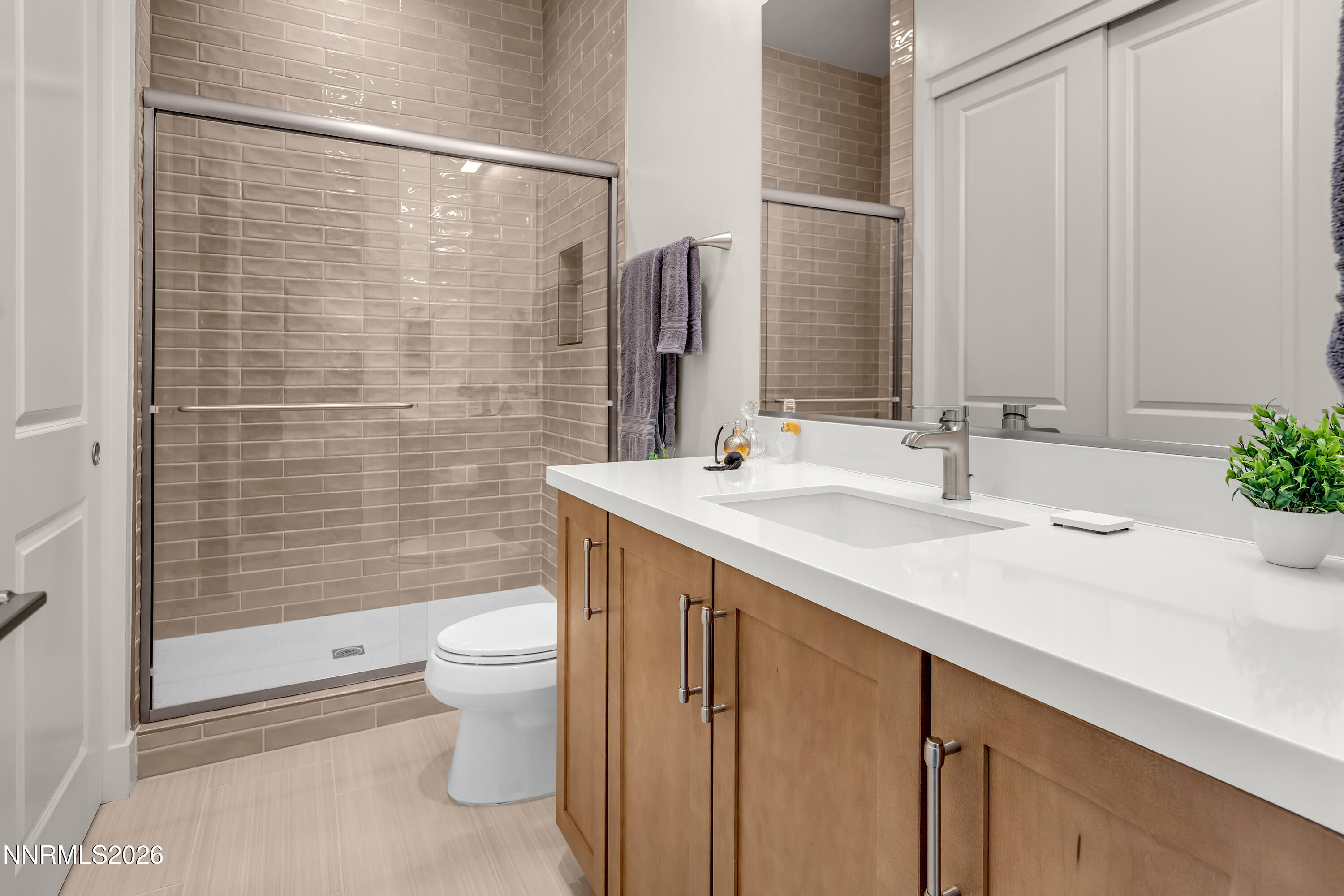 9109 Wild Skies Way Reno, NV 89523 - Photo 34 of 81 a bathroom with a sink a toilet and shower
