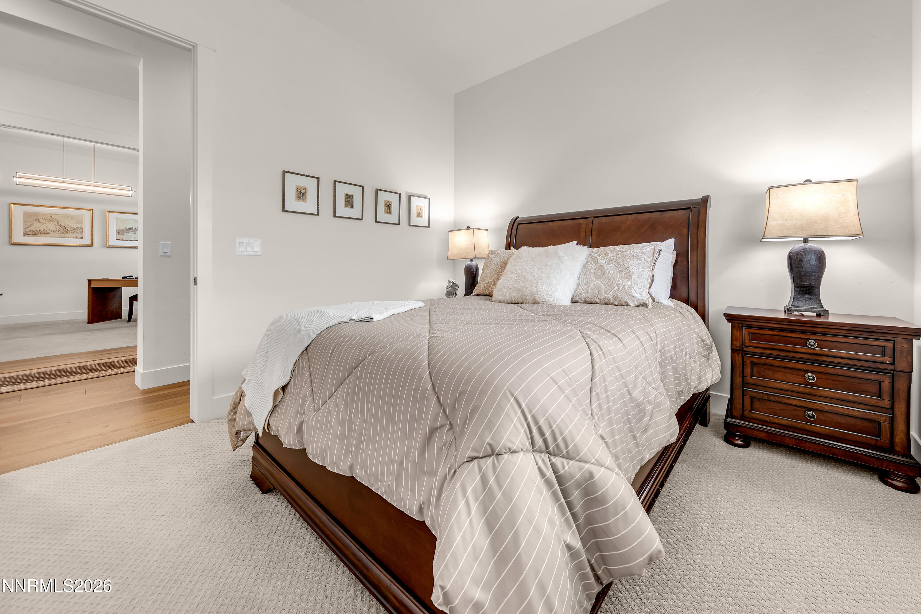 9109 Wild Skies Way Reno, NV 89523 - Photo 36 of 81 a bedroom with a bed and a lamp on table