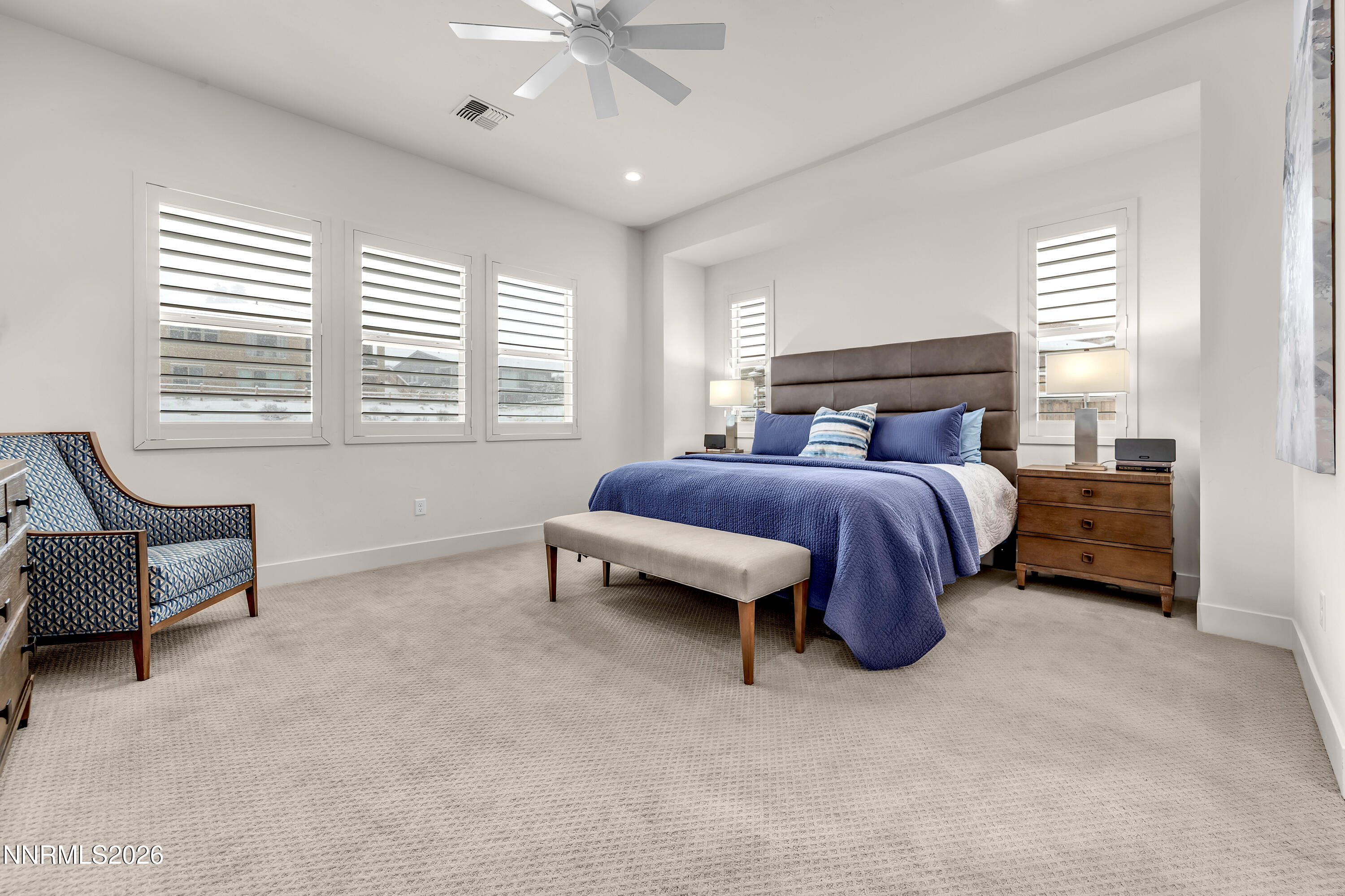 9109 Wild Skies Way Reno, NV 89523 - Photo 48 of 81 a bedroom with a bed and a couch