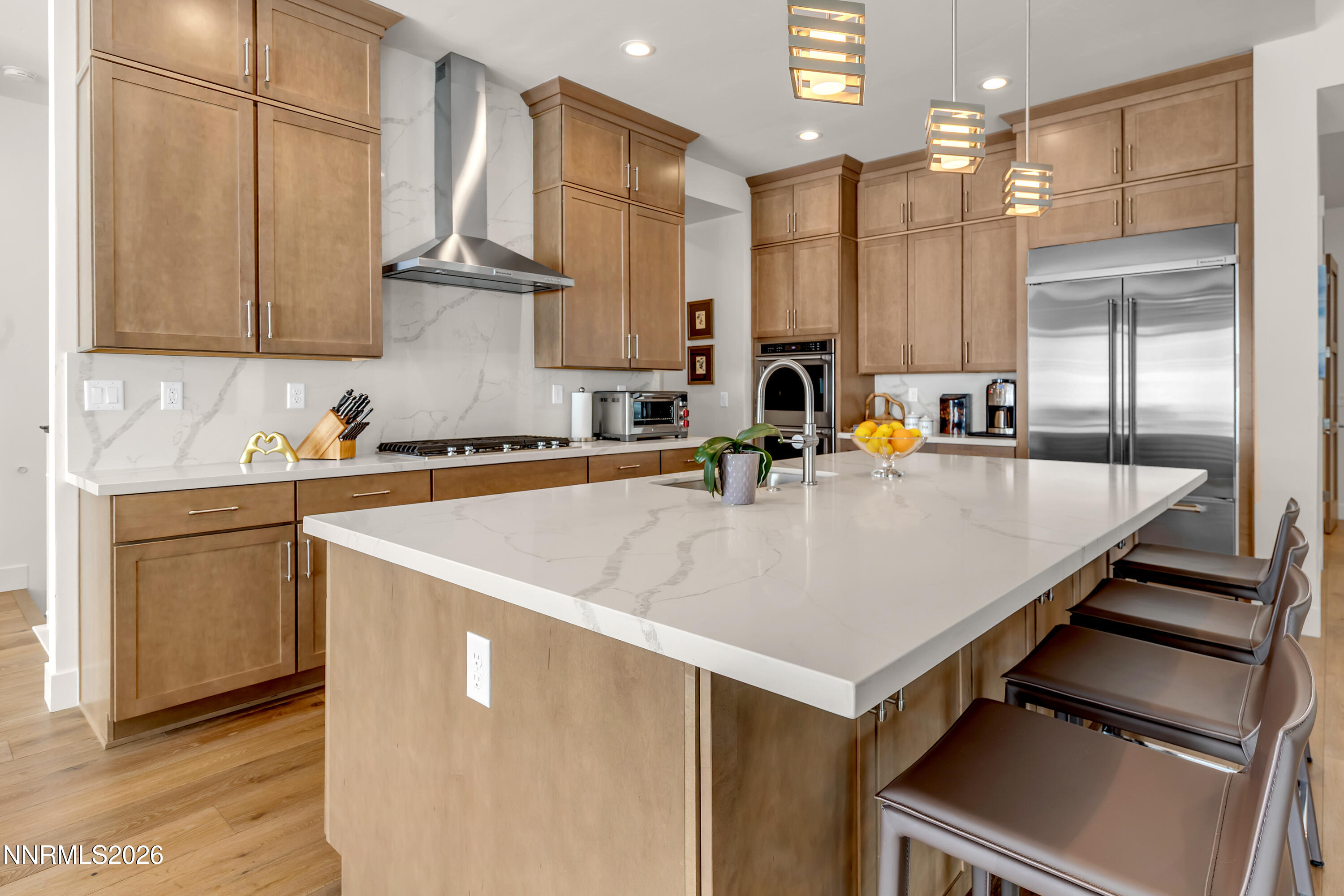 9109 Wild Skies Way Reno, NV 89523 - Photo 60 of 81 a kitchen with kitchen island a sink appliances and cabinets