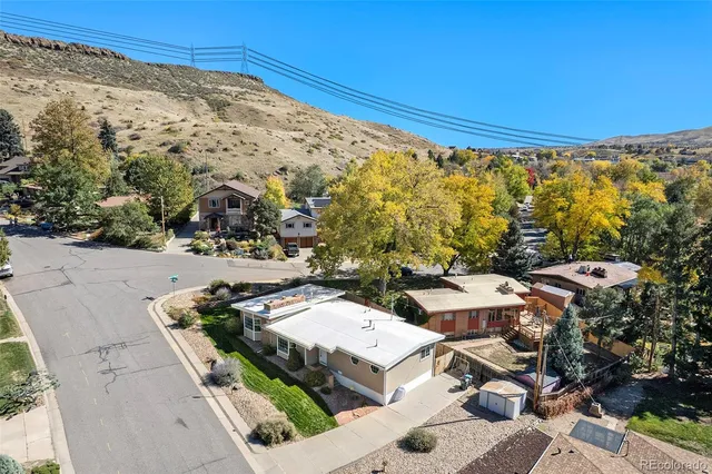 an aerial view of a residential houses and city street
